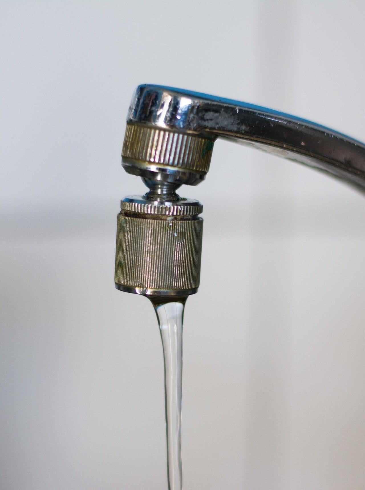 Water flowing from a polished tap